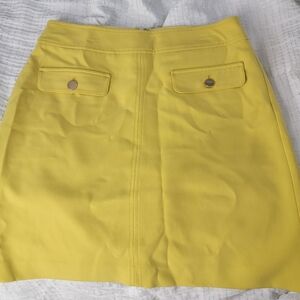bright yellow skirt with front pockets